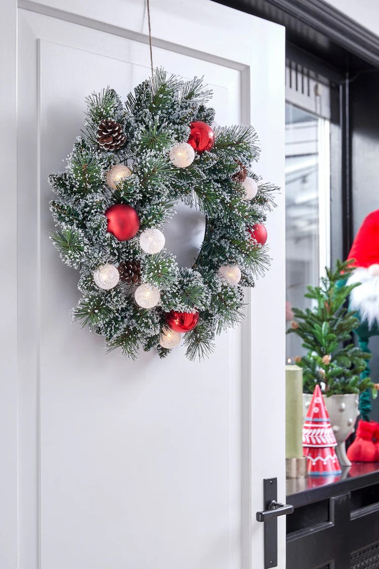 "Kaprun wreath green frosted red 10L TIPS 88 battery operated - 50 cm
